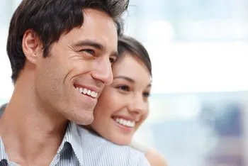 man and woman smiling