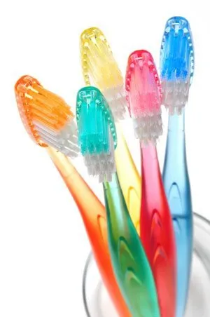 toothbrushes on a glass
