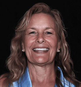 Woman smiling after dental crown make over